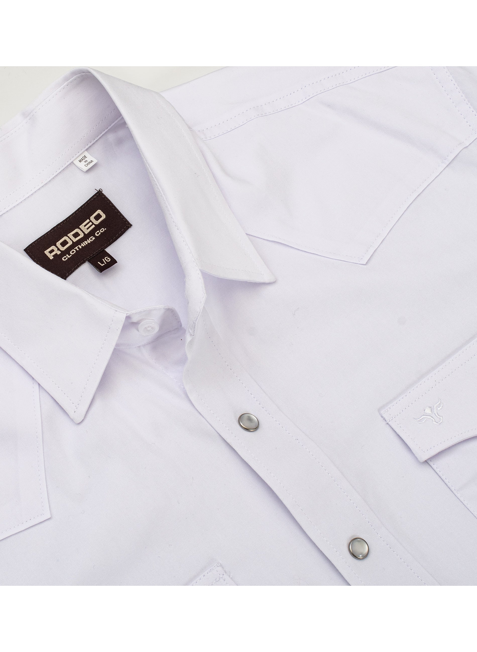 White dress shirt with collar and button details, featuring a Rodeo brand label.