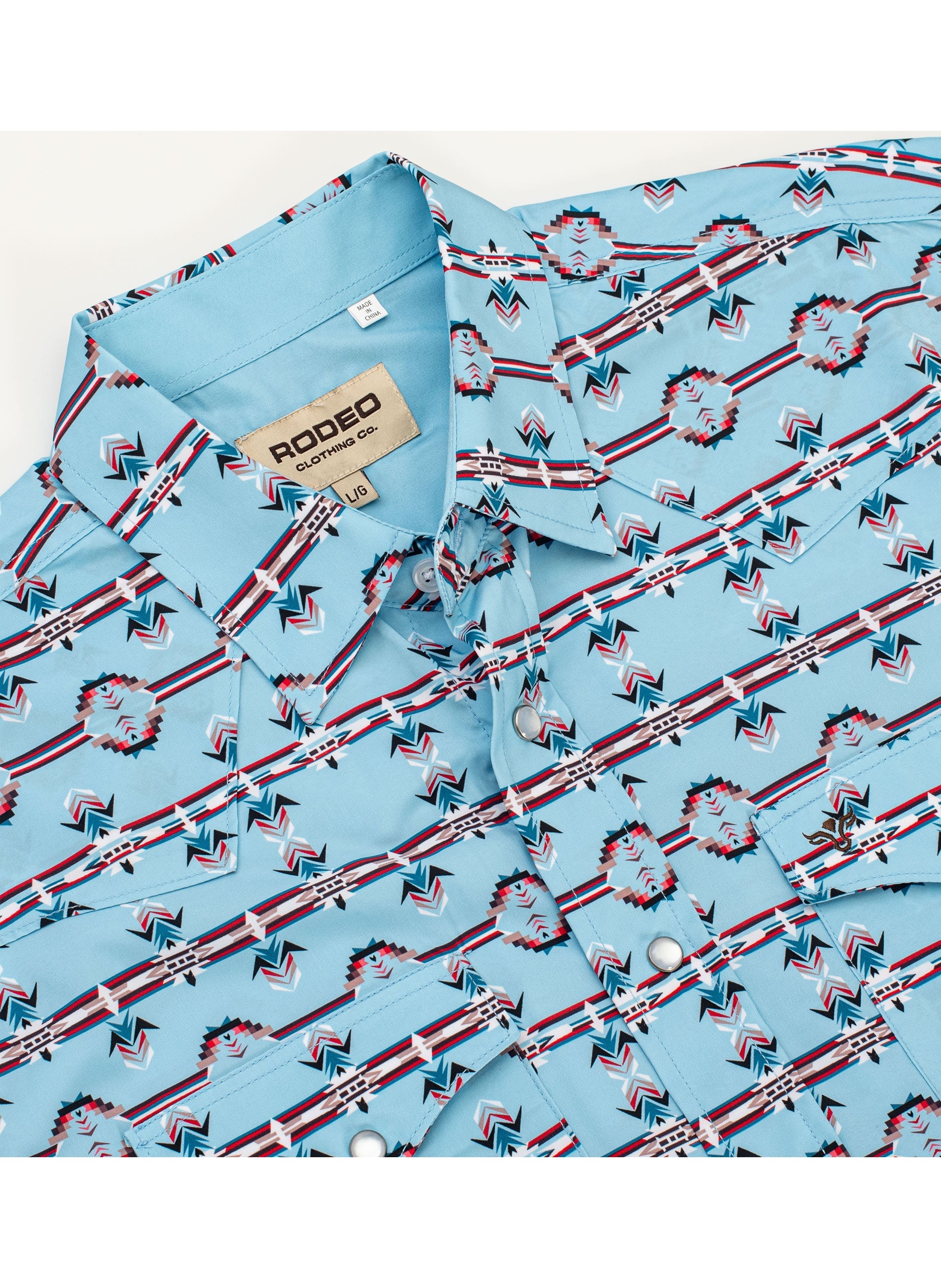 Blue patterned shirt with 'Rodeo' label on a white background