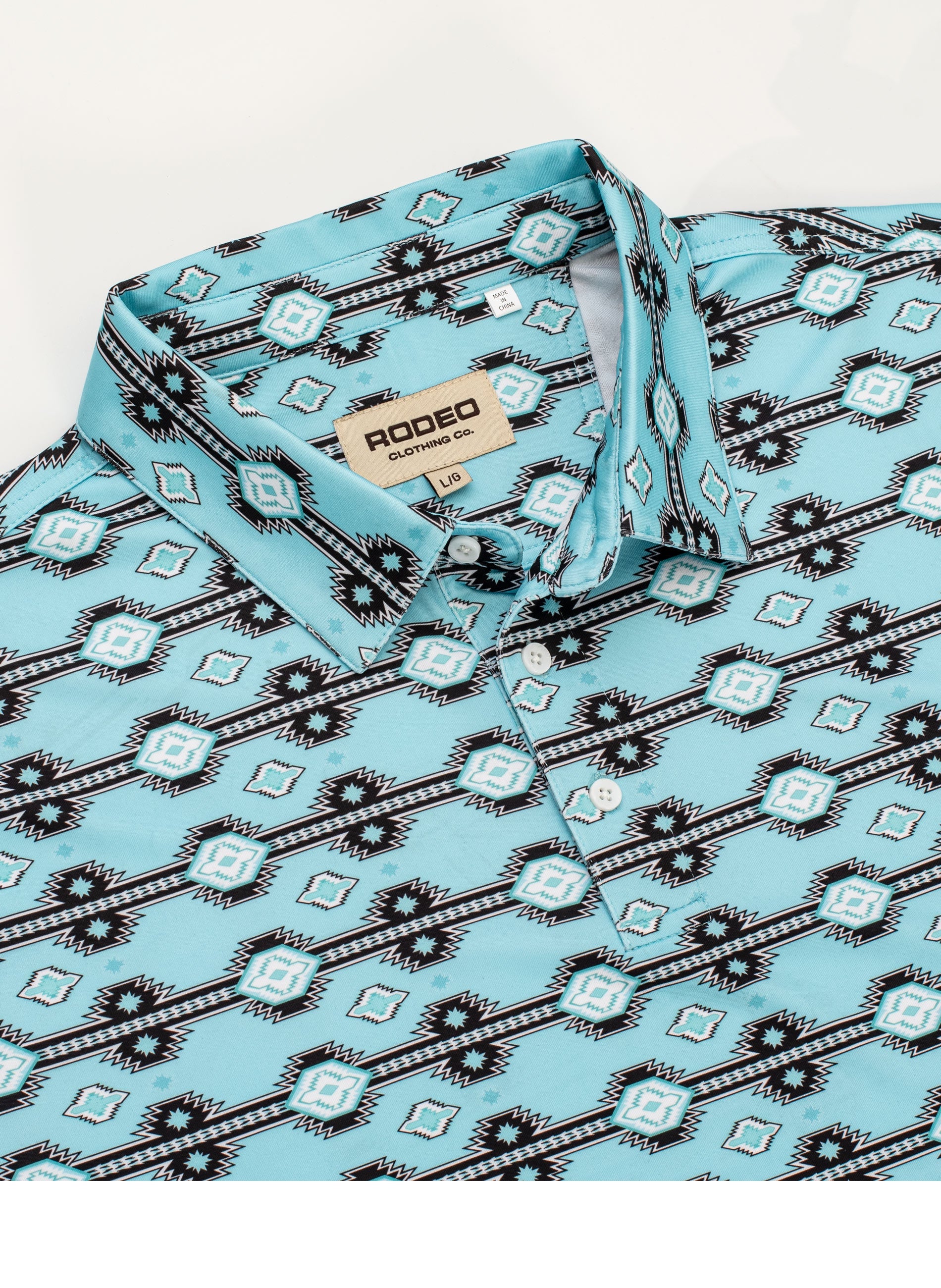 Light blue shirt with black geometric pattern, folded, on a white background